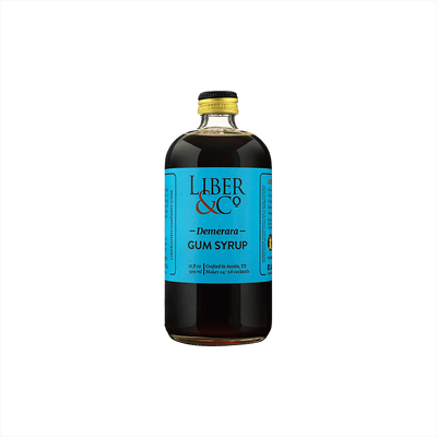 A large bottle of dark syrup with a canary blue label that reads: Liber & Co Demerara Gum Syrup. product image