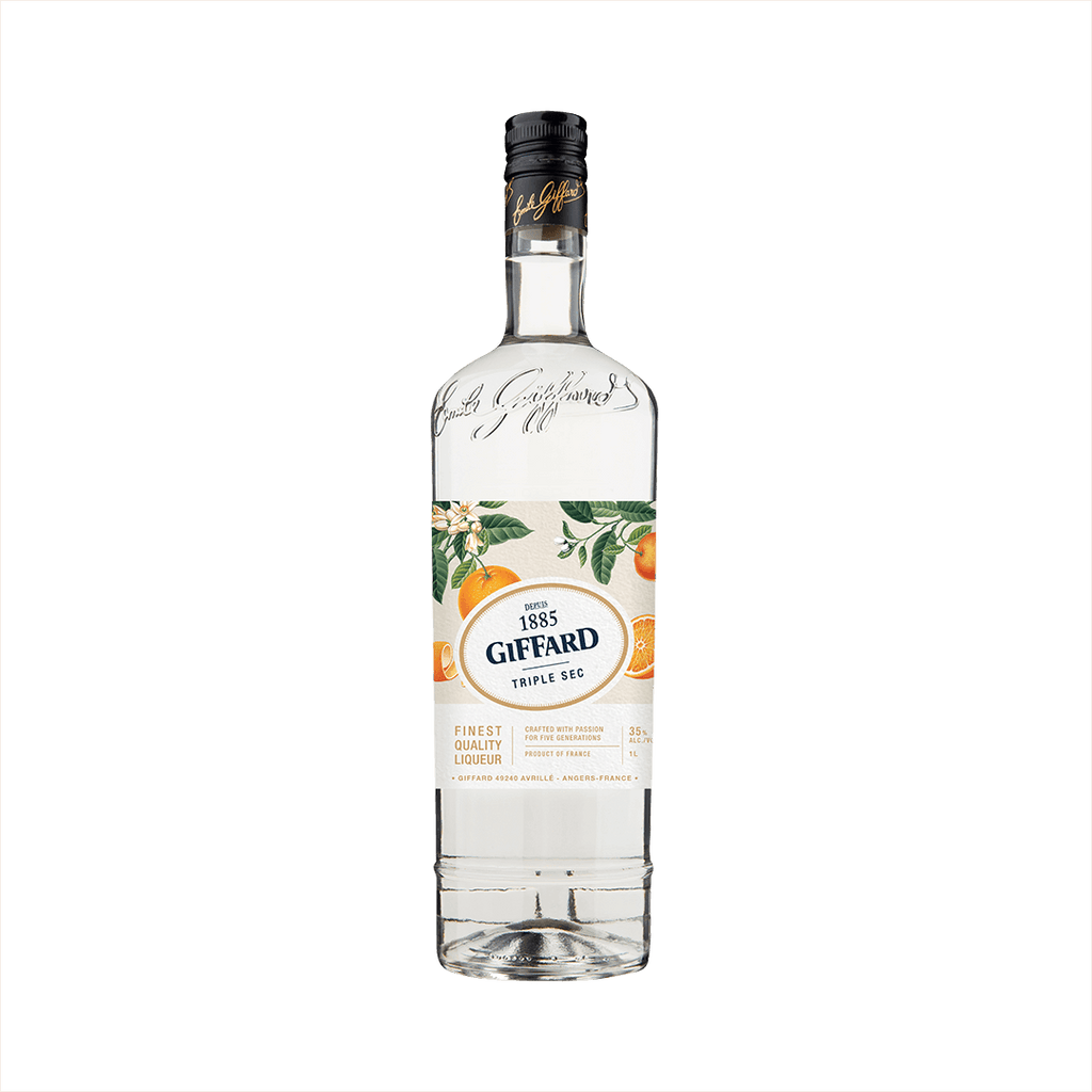 A clear tall bottle of triple sec with a beautifully illustrated label featuring oranges and orange leaves. The label reads 1885 Giffard Triple Sec