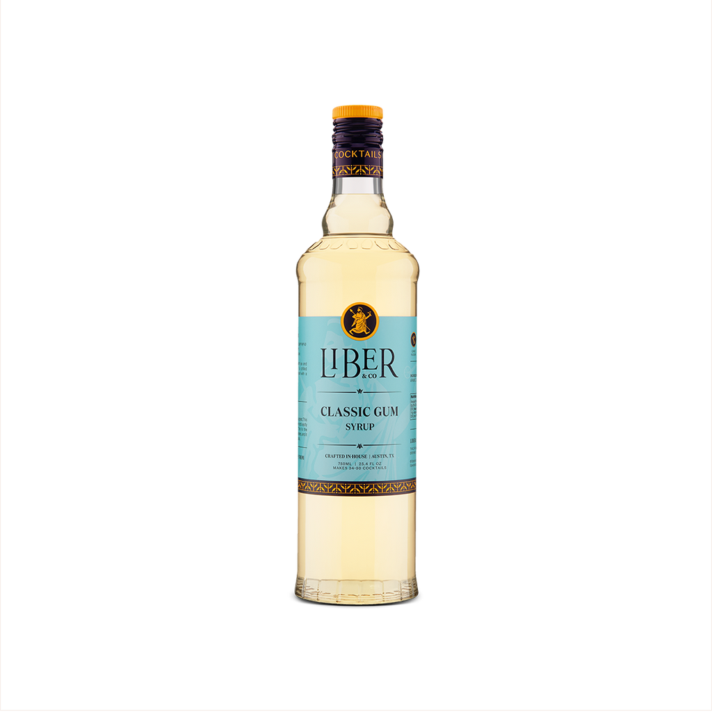A bottle of Liber & Co. Classic Gum Syrup with a label in shades of blue and white, displaying the brand name and product name.