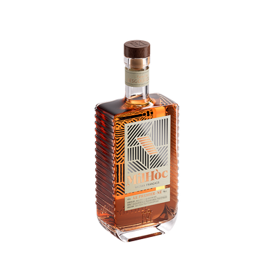 Bottle of Mihoc brandy on a white background