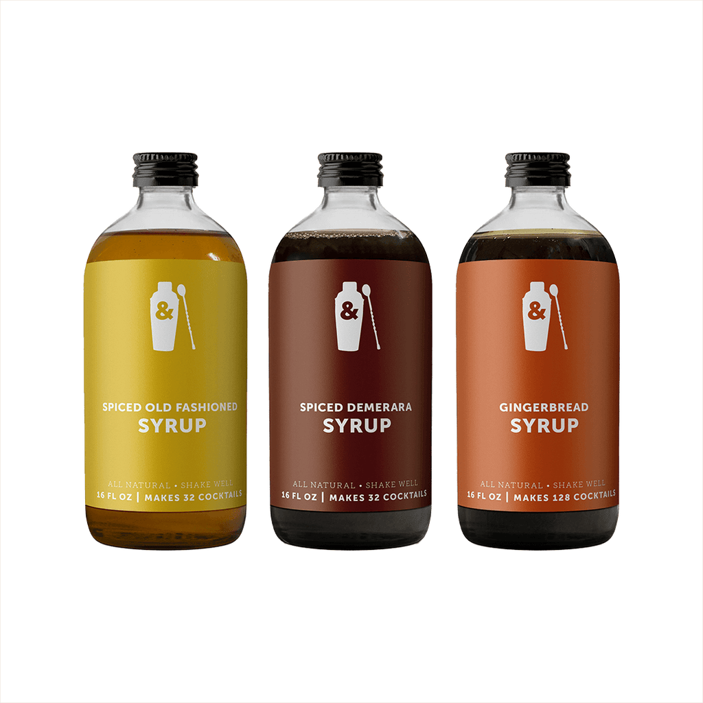 Bottles of Shaker & Spoon Spiced Old Fashioned, Spiced Demerara, and Gingerbread syrups.