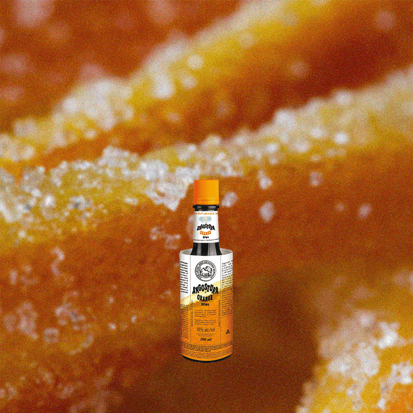 4oz Angostura Orange Bitters over up close orange candy.