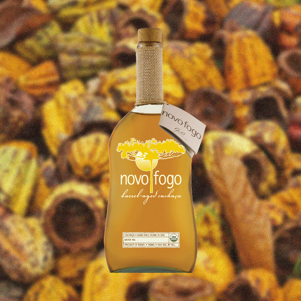 Bottle image of Novo Fogo Organic Aged Cachaca over a rustic yellow background image.
