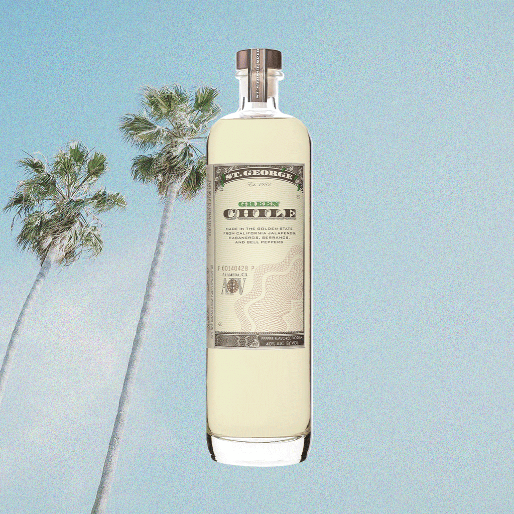 Bottle image of St. George Green Chili Vodka. Background image of palm tree and blue sky.