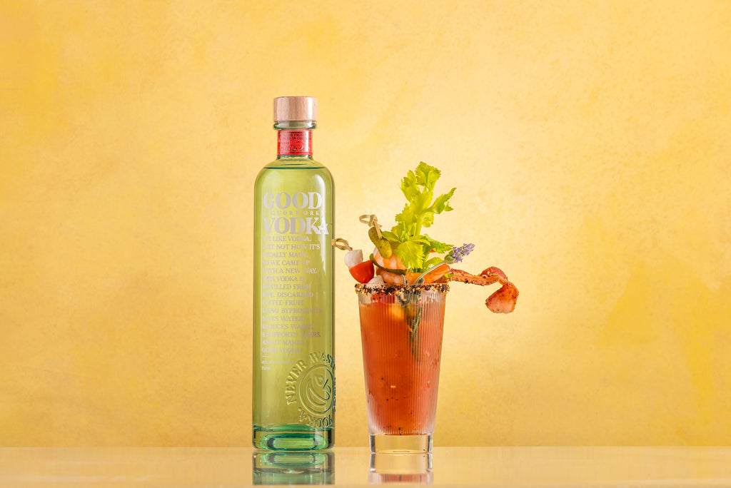 Bottle of Good Vodka and a bloody mary cocktail.