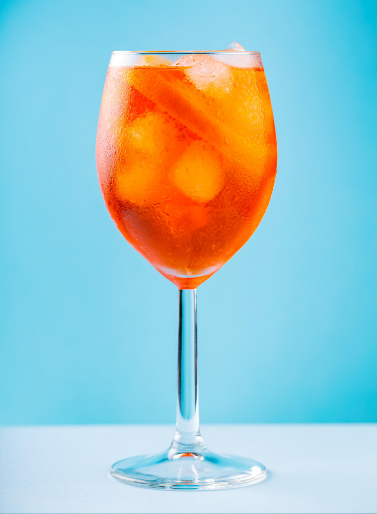 The South Slope Spritz: A cocktail recipe featuring gin, aperol, lillet blanc, and dry curacao