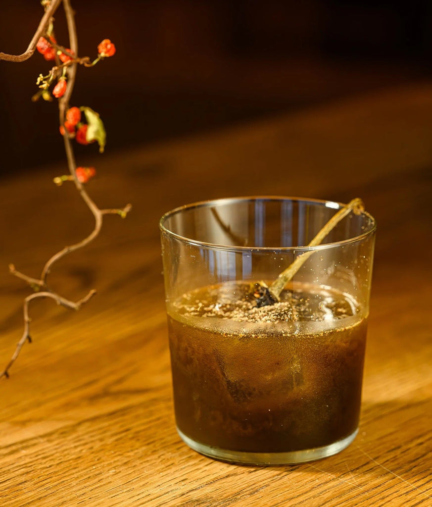 World of Ruin, a cocktail recipe featuring Kura Shochu, mezcal, and Ancho Chile Reyes liqueur