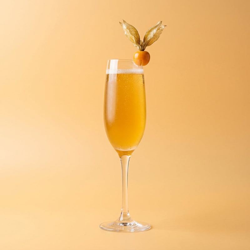 A photo of the Cognac Apricot Royale cocktail containing Hennessy V.S. Cognac, Giffard Abricot Du Roussillon, Freshly squeezed orange juice, Perrier Jouet Grand Brut Champagne in a Flute.