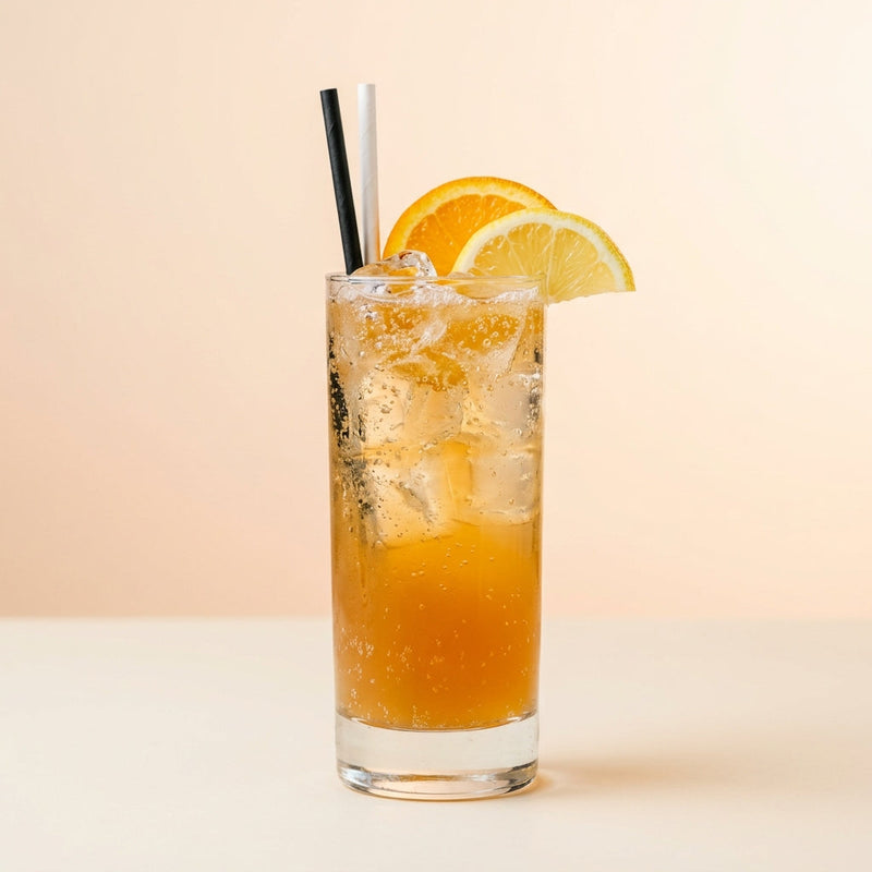 A photo of the Reposado Fizz cocktail containing Milagro Reposado Tequila, Ferrand Dry Curaçao, Giffard Sugar Cane Syrup (Sirop Sucre de Canne), Freshly squeezed lemon juice, Angostura Aromatic Bitters, Club soda in a Collins.