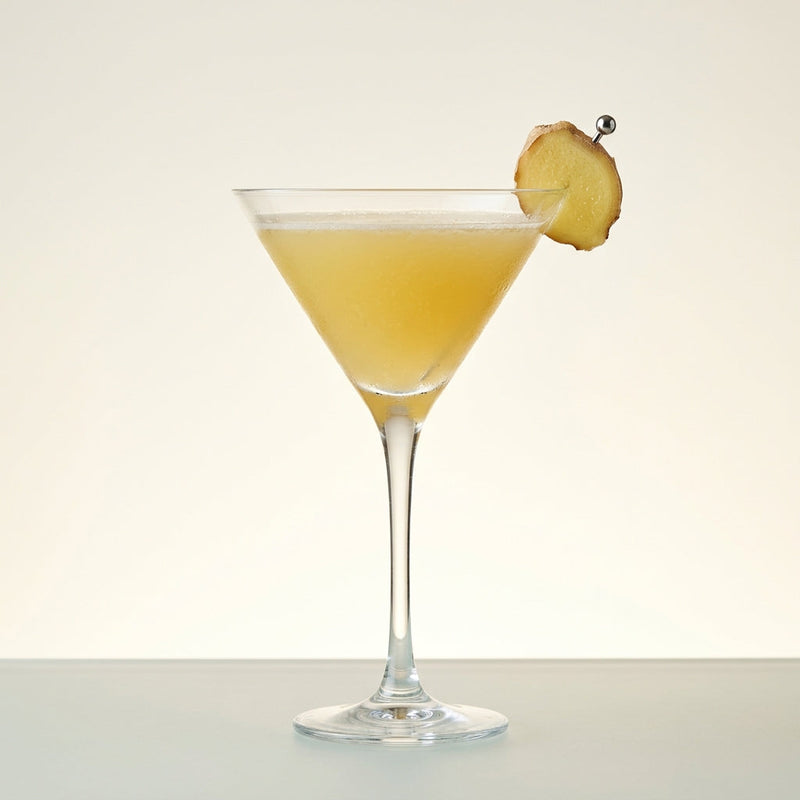 A photo of the Ginger Snap Martini cocktail containing Ketel One Vodka, Barrow's Intense Ginger Liqueur, Fresh pressed pineapple juice in a Martini.