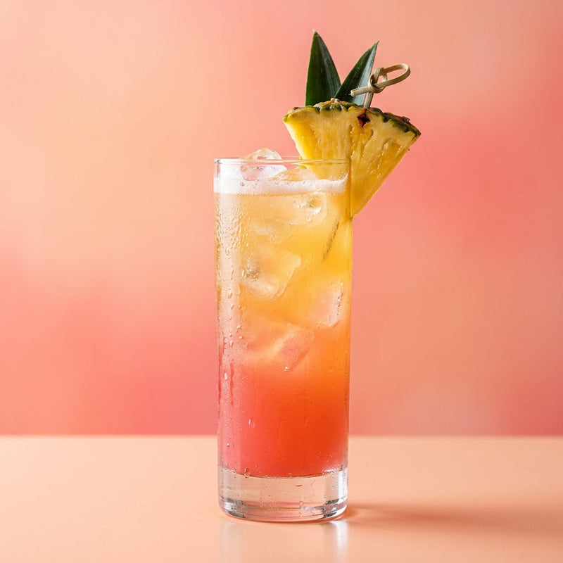 A photo of the Pineapple Collins cocktail containing Ketel One Vodka, Cranberry juice, Fresh pressed pineapple juice in a Collins.