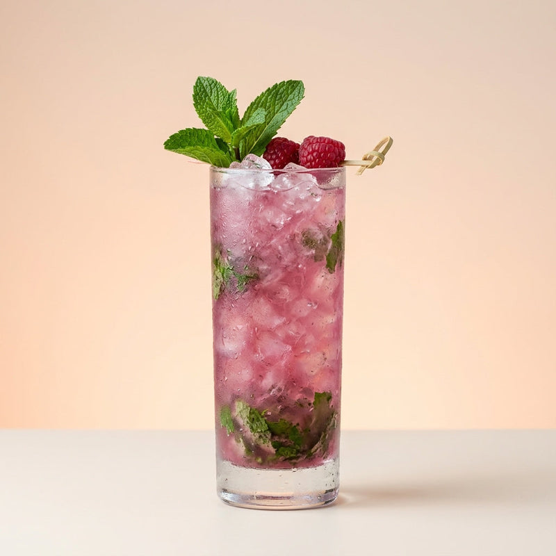 A photo of the Raspberry Rum Smash cocktail containing Mint leaves, Planteray 3 Stars White Rum, Chambord Liqueur, Freshly squeezed lime juice, Giffard Sugar Cane Syrup (Sirop Sucre de Canne) in a Collins.