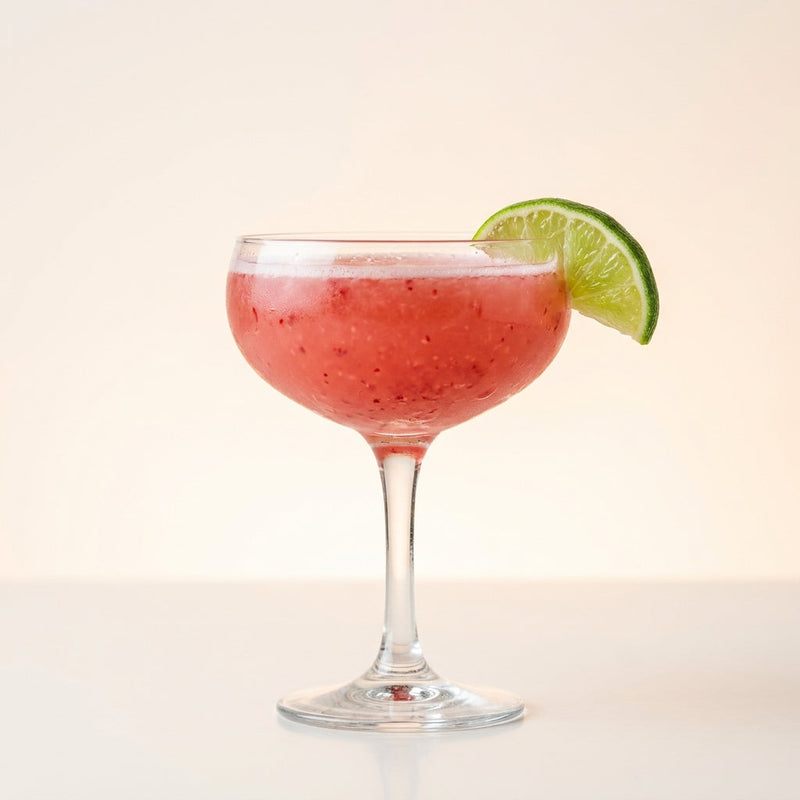 A photo of the Raspberry Milagro Margarita cocktail containing Raspberries, Milagro Reposado Tequila, Giffard Triple Sec, Freshly squeezed lime juice, Giffard Sugar Cane Syrup (Sirop Sucre de Canne) in a Coupe.