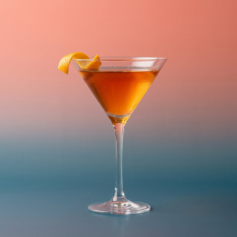 A photo of the Bourbon Bijou Sour cocktail containing Savage & Cooke Cask Finished Bourbon, English orange marmalade, Peychaud's Bitters, Giffard Sugar Cane Syrup (Sirop Sucre de Canne) in a Martini.