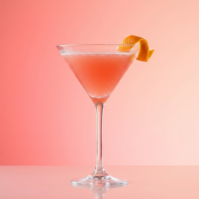 A photo of the Citrus Vodka Martini cocktail containing Ketel One Vodka, Giffard Triple Sec, Freshly squeezed pink grapefruit juice in a Martini.