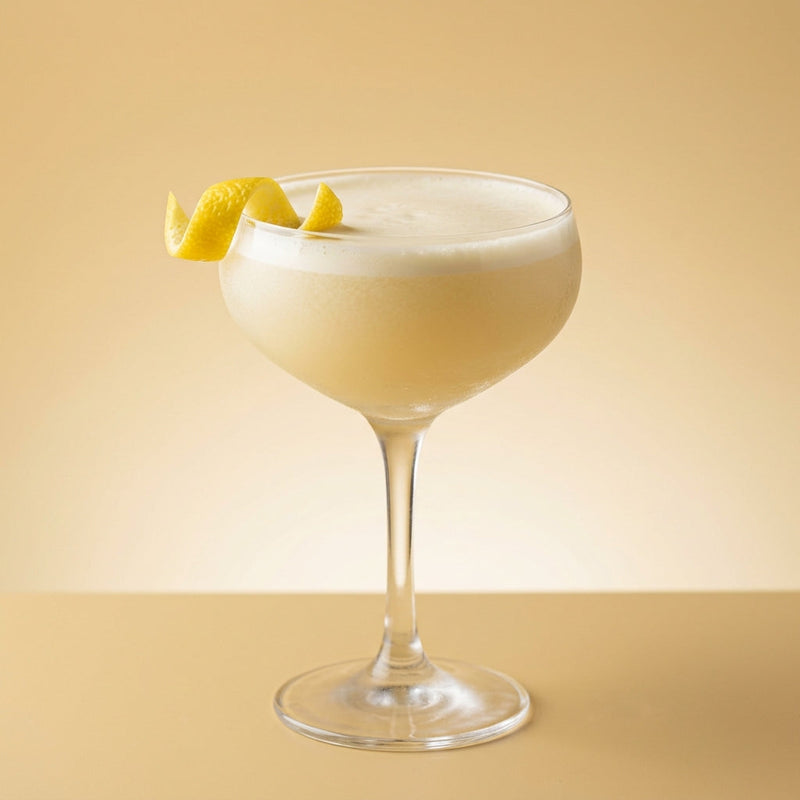 A photo of the Rattlesnake cocktail containing Savage & Cooke Cask Finished Bourbon, Freshly squeezed lemon juice, Giffard Sugar Cane Syrup (Sirop Sucre de Canne), Pernod Absinthe, Fee Brothers Fee Foam Egg White Alternative in a Coupe.