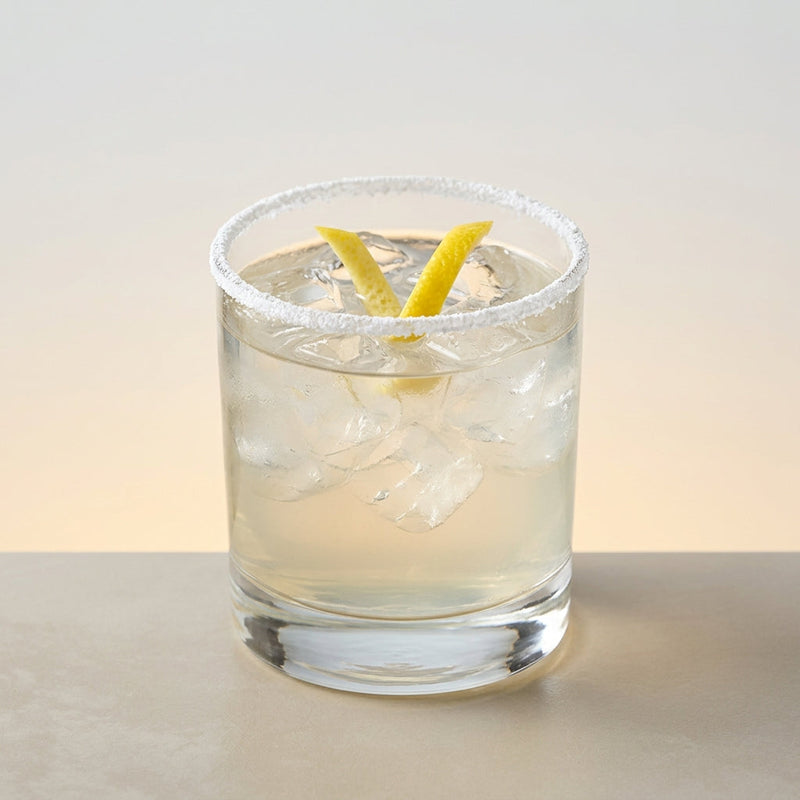 A photo of the Cherry Blossom Hour cocktail containing Etter Kirsch AOP Zug Eau de Vie, Suze Aperitif, Yellow Chartreuse, Freshly squeezed lemon juice in a Old-Fashioned.