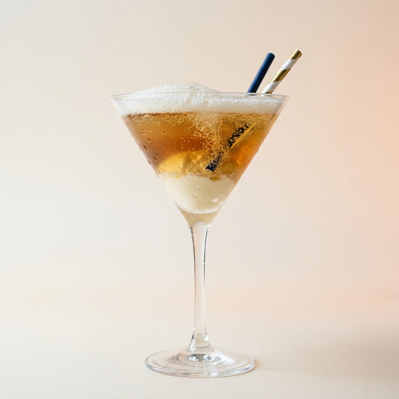 A photo of the Soyer Au Champagne cocktail containing Vanilla ice-cream, Hennessy V.S. Cognac, Grand Marnier, Luxardo Maraschino Liqueur, Perrier Jouet Grand Brut Champagne in a Martini.