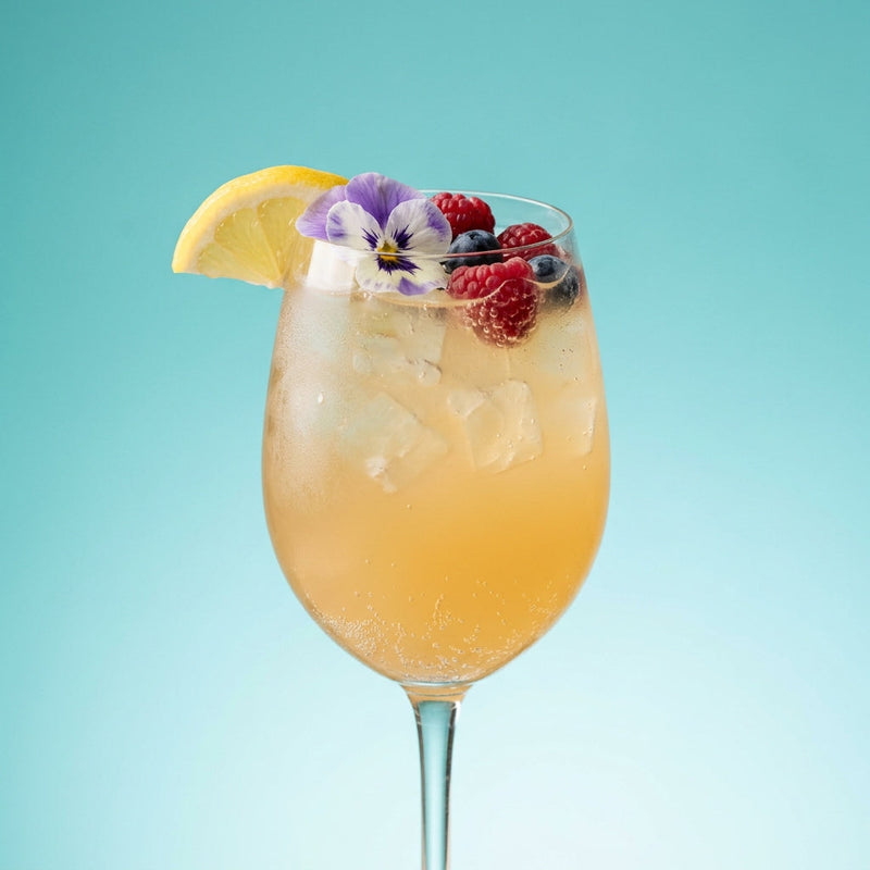 A photo of the Gin Blossom Fizz cocktail containing Beefeater London Dry Gin, Luxardo Maraschino Liqueur, Giffard Orgeat Syrup, Freshly squeezed lemon juice, Giffard Sugar Cane Syrup (Sirop Sucre de Canne), Perrier Jouet Grand Brut Champagne in a Goblet.