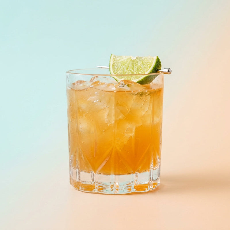 A photo of the Montego Bay cocktail containing Rhum Clément Canne Bleue, Giffard Triple Sec, Freshly squeezed lime juice, Giffard Sugar Cane Syrup (Sirop Sucre de Canne), Angostura Aromatic Bitters in a Old-Fashioned.