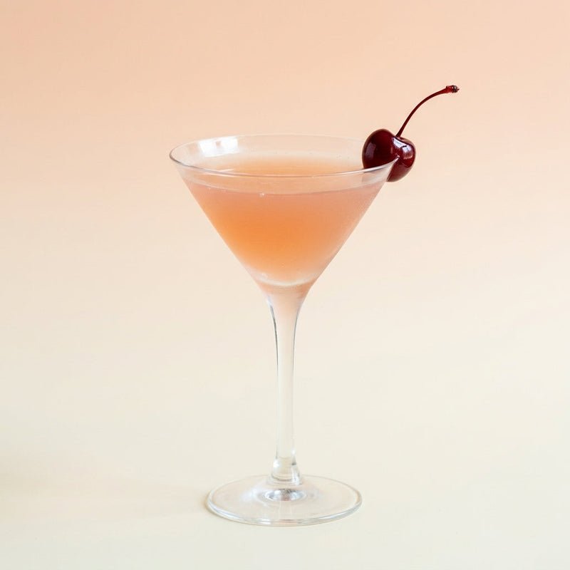 A photo of the The White Rum Daisy cocktail containing Planteray 3 Stars White Rum, Freshly squeezed pink grapefruit juice, Giffard Sugar Cane Syrup (Sirop Sucre de Canne) in a Martini.