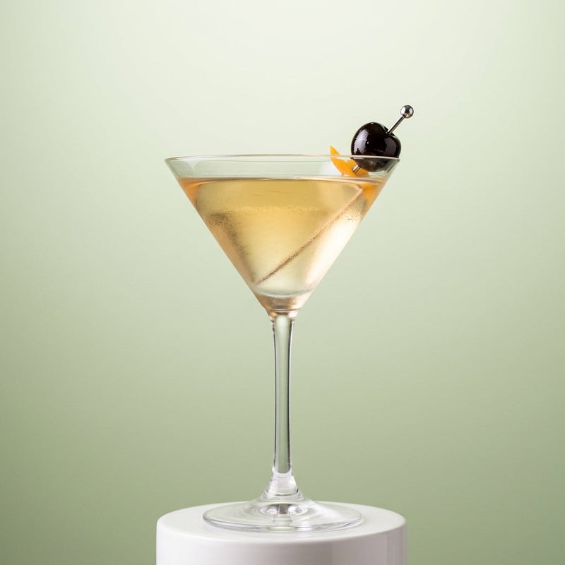 A photo of the Roc-A-Coe cocktail containing Beefeater London Dry Gin, Lustau Dry Amontillado Los Arcos, Giffard Sugar Cane Syrup (Sirop Sucre de Canne), Chilled water in a Martini.