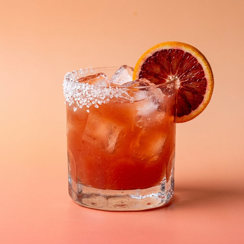 A photo of the Crimson Margarita cocktail containing Patron Silver Tequila, Giffard Triple Sec, Campari Aperitivo, Blood orange juice, Freshly squeezed lime juice, Giffard Sugar Cane Syrup (Sirop Sucre de Canne) in a Old-Fashioned.