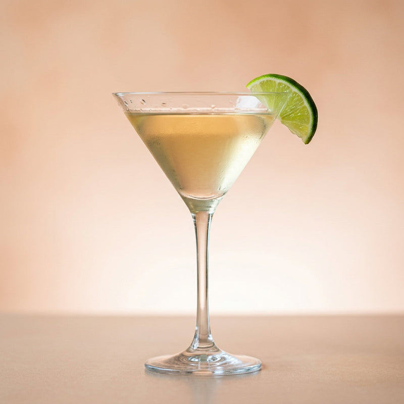 A photo of the Pegu Club cocktail containing Beefeater London Dry Gin, Giffard Triple Sec, Freshly squeezed lime juice, Giffard Sugar Cane Syrup (Sirop Sucre de Canne), Angostura Aromatic Bitters, Angostura Orange Bitters in a Martini.