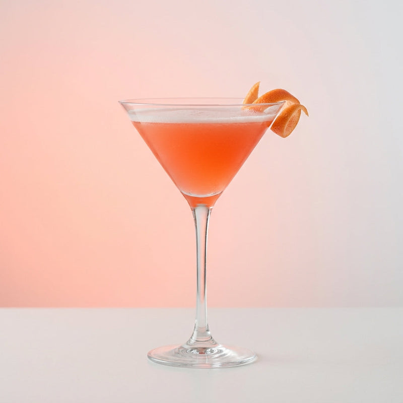 A photo of the Elderflower Martini cocktail containing Beefeater London Dry Gin, St-Germain Elderflower Liqueur, Freshly squeezed pink grapefruit juice, Cranberry juice in a Martini.