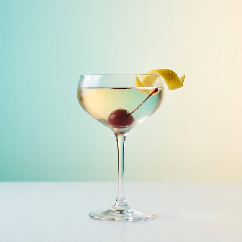 A photo of the Tuxedo Cocktail No.1 cocktail containing Lemon peel, Beefeater London Dry Gin, Noilly Prat Dry Vermouth, Pernod Absinthe in a Coupe.