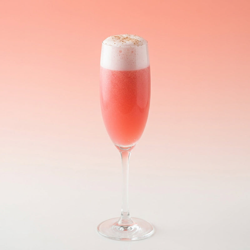 A photo of the Rum Blush Fizz cocktail containing Planteray 3 Stars White Rum, Freshly squeezed pink grapefruit juice, Liber & Co. Real Grenadine, Fee Brothers Fee Foam Egg White Alternative in a Flute.