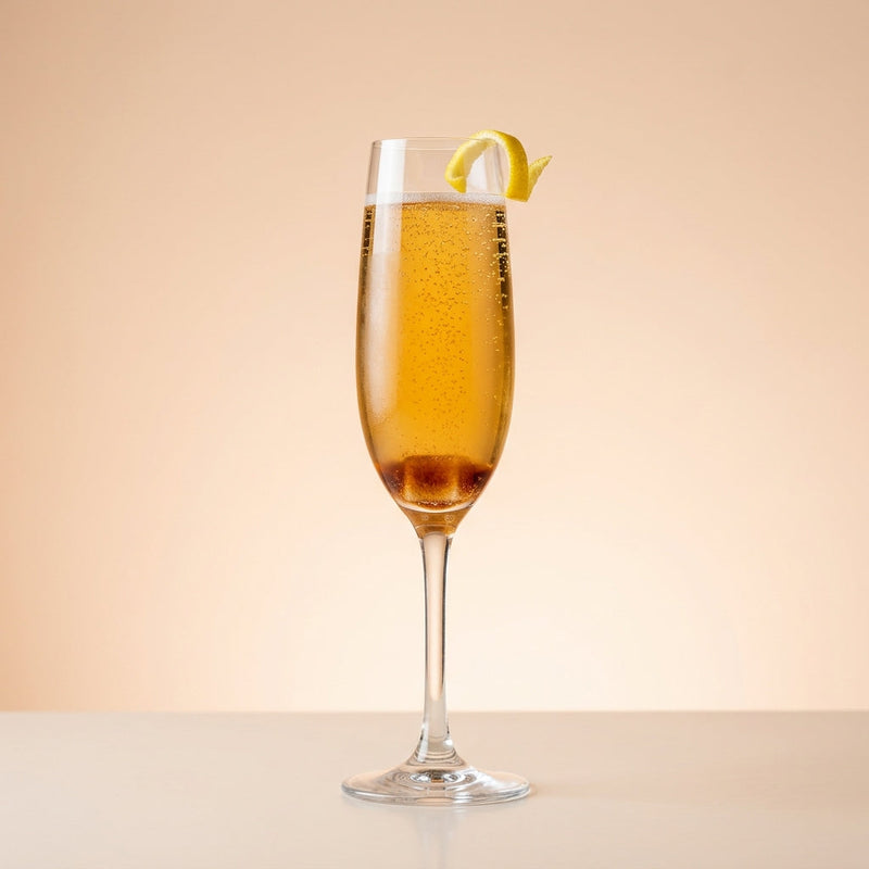 A photo of the Prince of Wales cocktail containing Liber & Co. Classic Gum Syrup, Angostura Aromatic Bitters, Hennessy V.S. Cognac, Grand Marnier, Perrier Jouet Grand Brut Champagne in a Flute.