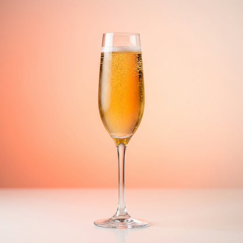 A photo of the Cognac Orchard Royale cocktail containing Hennessy V.S. Cognac, Roger Groult 3 Year Reserve Pays D'Auge Calvados, Giffard Triple Sec, Freshly squeezed lemon juice, Perrier Jouet Grand Brut Champagne in a Flute.