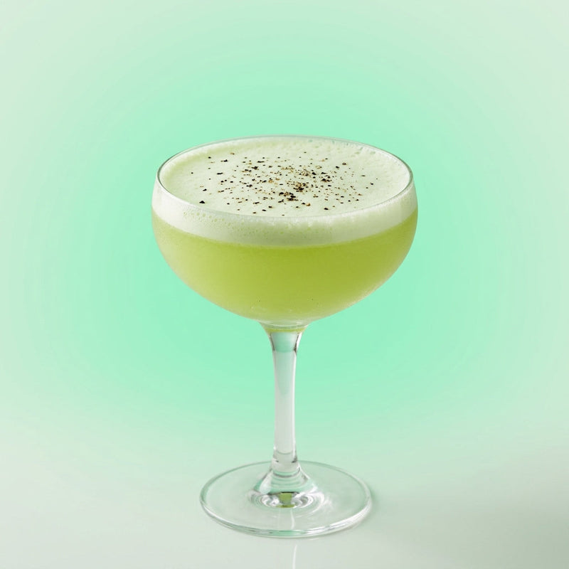 A photo of the Gin & Tonic Sour cocktail containing English cucumber peeled, Beefeater London Dry Gin, Suze Aperitif, Freshly squeezed lemon juice, Giffard Sugar Cane Syrup (Sirop Sucre de Canne), Fee Brothers Fee Foam Egg White Alternative in a Coupe.