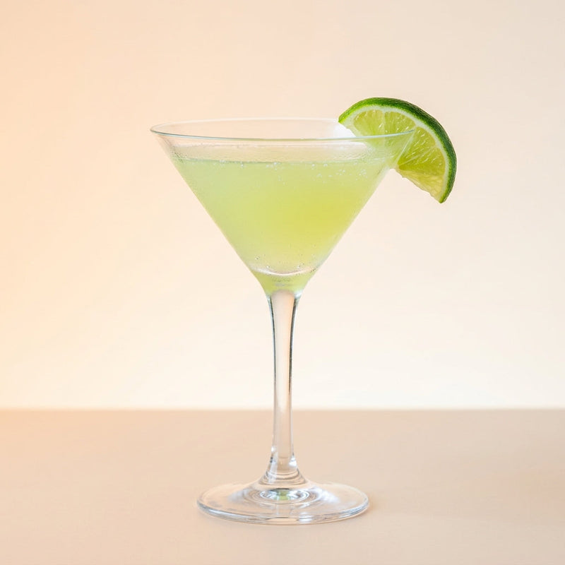 A photo of the Rum Sidecar cocktail containing Planteray 3 Stars White Rum, Giffard Triple Sec, Freshly squeezed lime juice, Giffard Sugar Cane Syrup (Sirop Sucre de Canne), Rose water in a Martini.