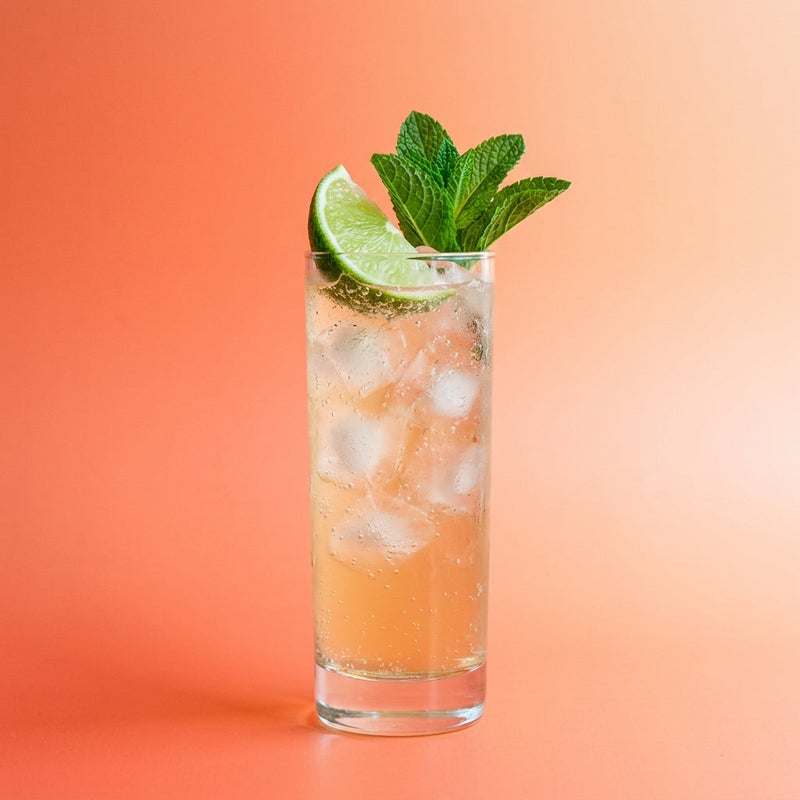 A photo of the Ginger Snap Collins cocktail containing Fresh root ginger (thumbnail sized), Beefeater London Dry Gin, Freshly squeezed lime juice, Giffard Sugar Cane Syrup (Sirop Sucre de Canne), Mint leaves, Three Cents Ginger Beer in a Collins.