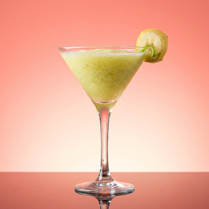 A photo of the Frozen Banana Mint Daiquiri cocktail containing Planteray 3 Stars White Rum, Giffard Banane du Brésil Liqueur, Tempus Fugit Crème De Menthe, Freshly squeezed lime juice, Giffard Sugar Cane Syrup (Sirop Sucre de Canne) in a Martini.