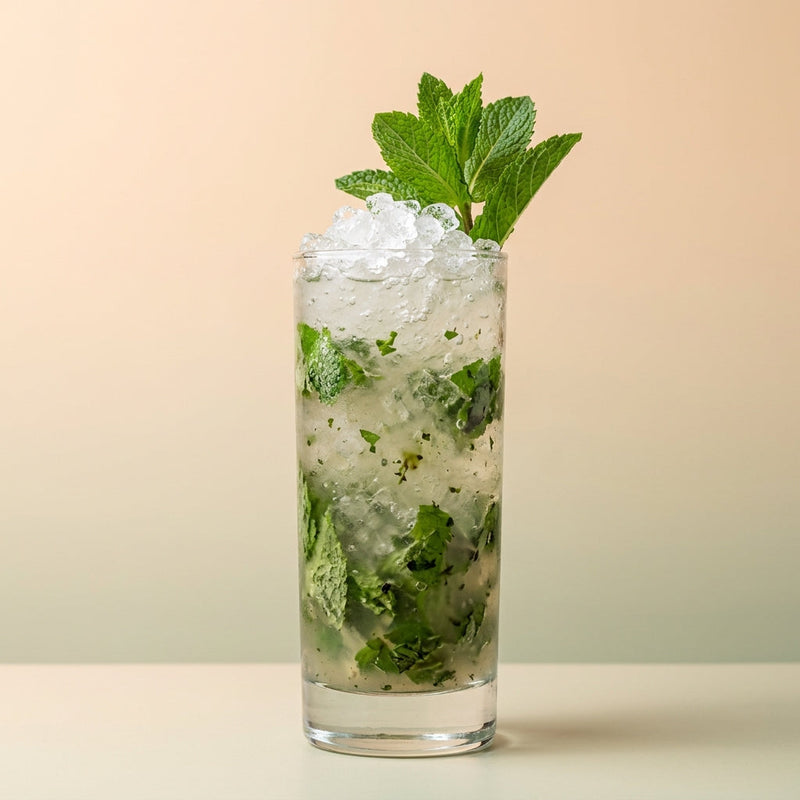 A photo of the Rum Garden Smash cocktail containing Mint leaves, Basil leaves, Planteray 3 Stars White Rum, Freshly squeezed lime juice, Giffard Sugar Cane Syrup (Sirop Sucre de Canne) in a Collins.