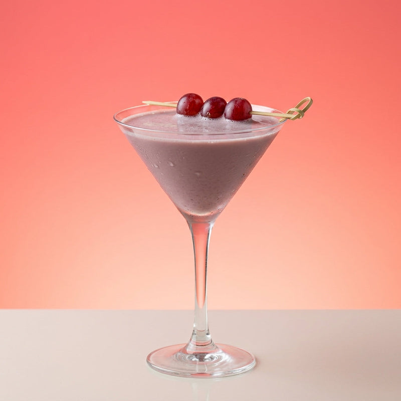 A photo of the Rum & Cassis Grape Smash cocktail containing Seedless white grapes, Appleton Estate 8 Year Old Reserve Rum, Single cream / half-and-half, Milk, Giffard Sugar Cane Syrup (Sirop Sucre de Canne), LEJAY LAGOUTE Crème de Cassis in a Martini.