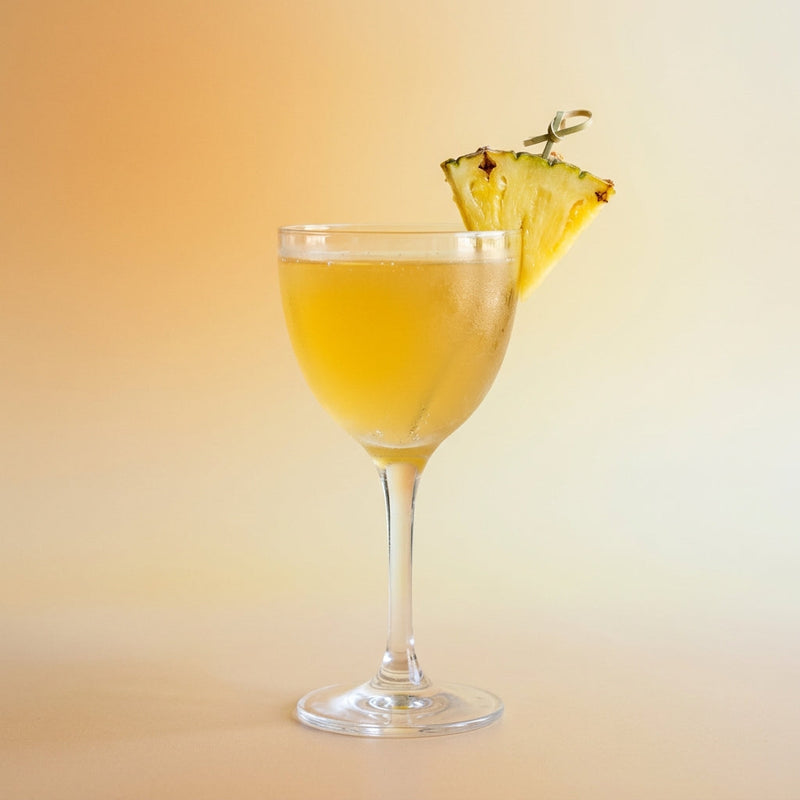 A photo of the Smoky Gentian Sour cocktail containing Suze Aperitif, Del Maguey Vida Mezcal, Yellow Chartreuse, Freshly squeezed lime juice, Fresh pressed pineapple juice in a Nick & Nora.