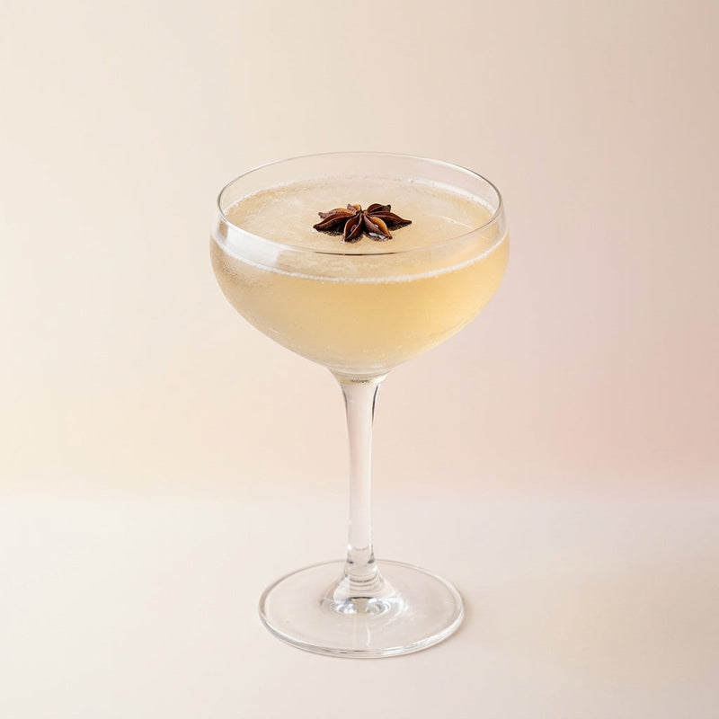 A photo of the The Nordic Star cocktail containing Brennivin Aquavit 1L, Freshly squeezed lime juice, Giffard Sugar Cane Syrup (Sirop Sucre de Canne) in a Coupe.