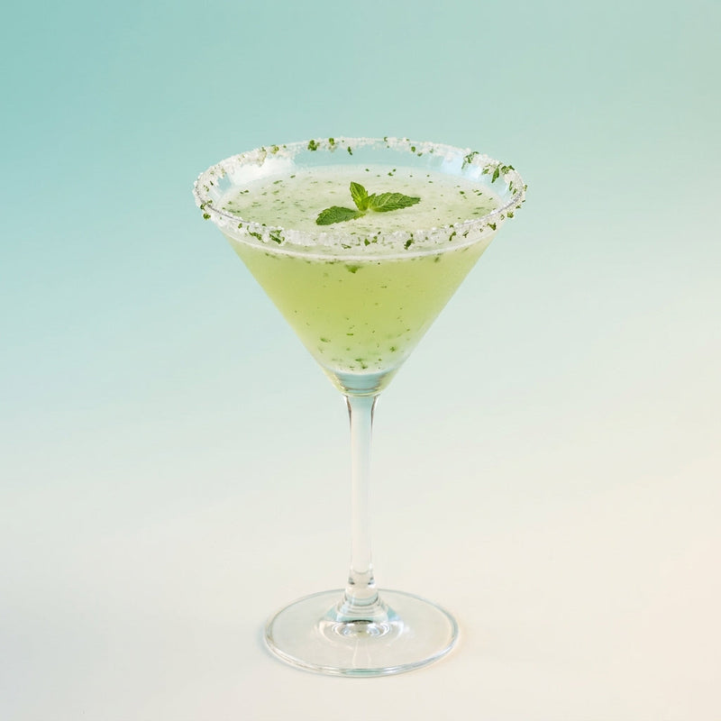 A photo of the Maison Charles Daiquiri cocktail containing Mint leaves, Planteray 3 Stars White Rum, Freshly squeezed lime juice, Giffard Sugar Cane Syrup (Sirop Sucre de Canne), Chilled water (reduce if wet ice) in a Martini.