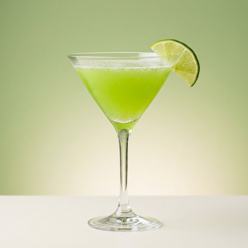 A photo of the Melon Martini cocktail containing Ketel One Vodka, MIDORI Melon Liqueur, Freshly squeezed lime juice, Giffard Sugar Cane Syrup (Sirop Sucre de Canne) in a Martini.
