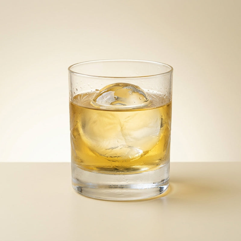 A photo of the Gilded Genever Bitter cocktail containing Bols Genever, Suze Aperitif, Galliano Autentico Liqueur, Dolin Génépy le Chamois Liqueur, Marie Brizard Crème de Cacao White in a Rocks.