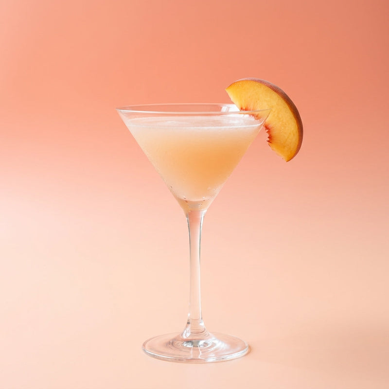 A photo of the Peachy Keen Martini cocktail containing Ketel One Vodka, Peach purée (white), Freshly squeezed lemon juice, Giffard Sugar Cane Syrup (Sirop Sucre de Canne) in a Martini.
