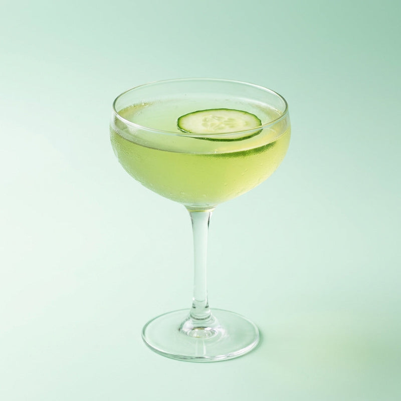 A photo of the Cucumber Garden Gimlet cocktail containing English cucumber peeled, Mint leaves, Beefeater London Dry Gin, Freshly squeezed lime juice, Giffard Sugar Cane Syrup (Sirop Sucre de Canne) in a Coupe.