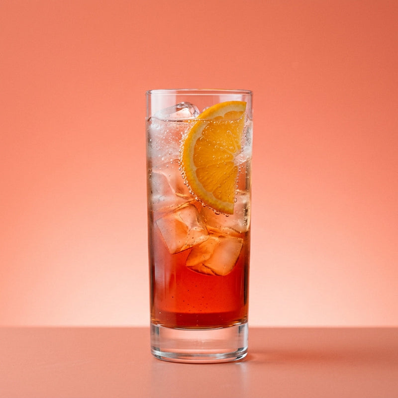 A photo of the Pisco Negroni Fizz cocktail containing 1615 Pisco Puro Quebranta, Campari Aperitivo, Martini & Rossi Rosso Sweet Vermouth, Bénédictine D.O.M. Liqueur, Freshly squeezed lemon juice, Club soda in a Collins.