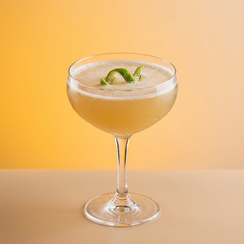 A photo of the The Beefeater Coupe cocktail containing Beefeater London Dry Gin, Honey water (3 honey to 1 water), Freshly squeezed lime juice in a Coupe.