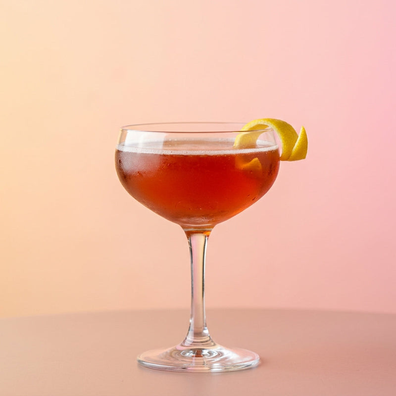 A photo of the Cherry Reserve Sour cocktail containing Appleton Estate 8 Year Old Reserve Rum, Heering Cherry Liqueur, Freshly squeezed lemon juice, Freshly squeezed pink grapefruit juice, Giffard Sugar Cane Syrup (Sirop Sucre de Canne) in a Coupe.