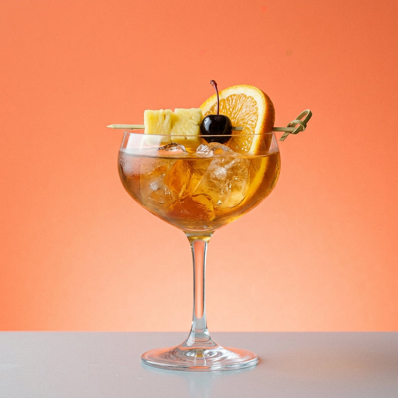 A photo of the Pablo Alvarez de Cañas Special cocktail containing Lemon peel, Hennessy V.S. Cognac, Valdespino Inocente Fino Sherry, Heering Cherry Liqueur, Giffard Sugar Cane Syrup (Sirop Sucre de Canne) in a Coupe.